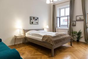 a bedroom with a bed and a window at comfortable 2BR Apt.-Near Wiener Stadthalle in Vienna