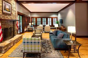 a living room with a couch and a fireplace at Montgomery Marriott Prattville Hotel & Conf Ctr at Capitol Hill in Prattville