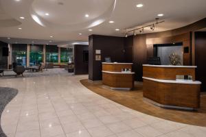 a lobby of a hotel with a reception desk at Courtyard High Point in High Point