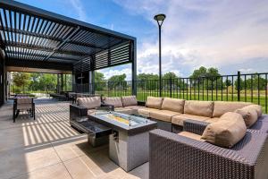 a patio with a couch and a table on a patio at Courtyard by Marriott Loveland Fort Collins in Loveland