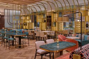 a restaurant interior with tables and chairs and tablesktop at The St. Regis San Francisco in San Francisco