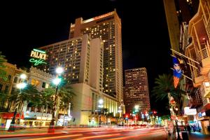 a busy city street at night with tall buildings at New Orleans Marriott in New Orleans