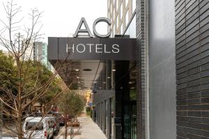a hotel sign on the side of a building at AC Hotel by Marriott Austin-University in Austin