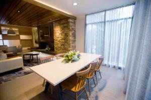 a dining room with a table and chairs and a living room at Fairfield Inn & Suites by Marriott Philadelphia Broomall/Newtown Square in Broomall
