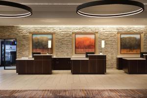 a lobby with a row of desks in a building at Minneapolis Marriott Northwest in Brooklyn Park