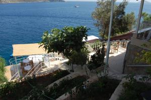 a house with a view of the ocean at Caretta Hotel in Kalkan