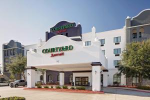 a rendering of the front of a hotel at Courtyard by Marriott Houma in Houma