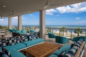 a restaurant with a view of the beach at Courtyard by Marriott Myrtle Beach Oceanfront in Myrtle Beach