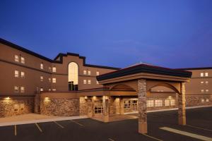 a building with a gazebo in a parking lot at Delta Hotels by Marriott Grande Prairie Airport in Grande Prairie