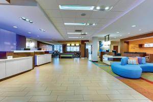 a lobby of a hospital with a blue couch at Fairfield Inn & Suites by Marriott Dunn I-95 in Dunn