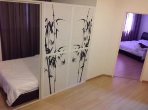 a bedroom with a sliding glass door with a bed at WenCozy 118 Vacation Home in George Town