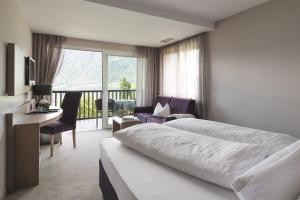 Posteľ alebo postele v izbe v ubytovaní Boutiquehotel Minigolf