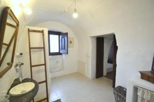 a bathroom with a sink and a mirror at Masseria Spina Resort in Monopoli