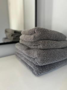 a stack of towels sitting on top of a counter at Mews Cottage in Appleby