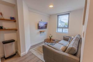 a living room with a couch and a table at St. Edwards Hill in Sligo