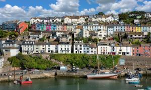a city with boats in the water and buildings at Harbour View in Brixham