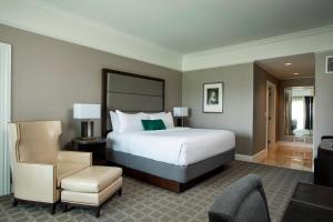 a hotel room with a bed and a chair at The Ballantyne, a Luxury Collection Hotel, Charlotte in Charlotte +90 photos
