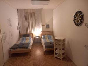 Posteľ alebo postele v izbe v ubytovaní Elefántos Apartman + 26 fotografií