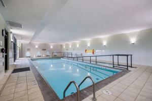a large indoor swimming pool in a building at SpringHill Suites by Marriott Enid in Enid