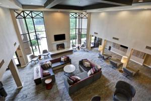 an overhead view of a living room with couches and a fireplace at Courtyard by Marriott Springfield in Springfield