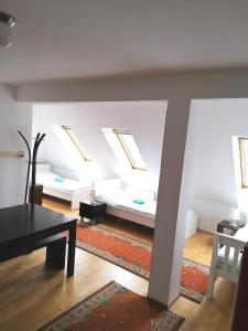 a living room with skylights on the ceiling at Favoriten-Rooms in Vienna