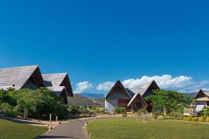 a house with a road leading to it at Sheraton New Caledonia Deva Spa & Golf Resort in Bourail