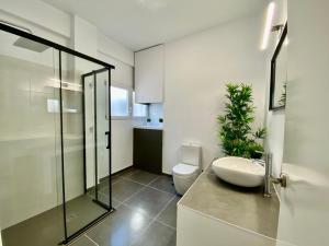 a bathroom with a sink and a toilet and a shower at Appartement Monica in Moraira