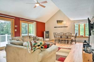 a living room with a couch and a table at Campton Home with Mountain Views Near Trails and Lake in Campton