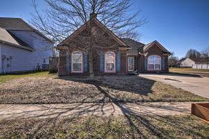 a brick house with a tree in front of it at Family Home with Yard about 15 Mi to Downtown! in Mooresville