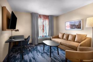 a living room with a couch and a table at Fairfield Inn & Suites Elizabeth City in Elizabeth City