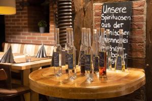 a table with several wine glasses on top of it at Hotel Stadtkrug in Weiden