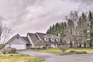 a house with a gray roof and a garage at Portland Area Home, 32 Mi to Mt Hood! in Damascus