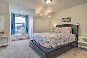 a bedroom with a bed and a window at Portland Area Home, 32 Mi to Mt Hood! in Damascus