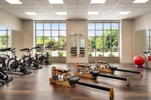 a gym with treadmills and elliptical machines at Cotton House, Cleveland, a Tribute Portfolio Hotel in Cleveland