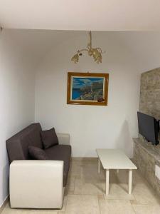 a living room with a couch and a coffee table at Casa Asia in Vieste