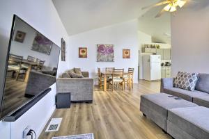 a living room with a couch and a tv at Reno Vacation Rental 1 Mi to Casinos! in Reno