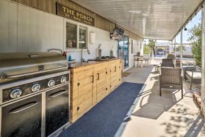 an outdoor kitchen with a stove and a patio at Cozy Lake Havasu City Getaway with Lake Views! in Lake Havasu City