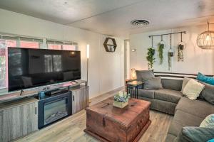 a living room with a large flat screen tv at Cozy Lake Havasu City Getaway with Lake Views! in Lake Havasu City
