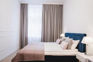 Posteľ alebo postele v izbe v ubytovaní hvile 23- łóżko queen size