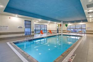 a large swimming pool in a building at TownePlace Suites by Marriott Kincardine in Kincardine