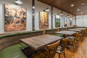 a row of tables and chairs in a restaurant at Fairfield Inn & Suites Ontario Rancho Cucamonga in Rancho Cucamonga