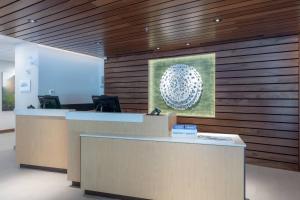 an office with a reception desk with a picture of a ball at Fairfield by Marriott Inn & Suites Revelstoke in Revelstoke