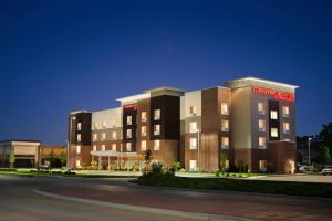 a rendering of a hotel building at night at TownePlace Suites Cedar Rapids Marion in Marion