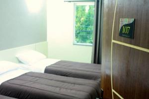 Postel nebo postele na pokoji v ubytování Hotel Portobello