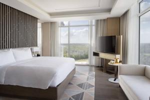 Cama ou camas em um quarto em JW Marriott Orlando Bonnet Creek Resort & Spa