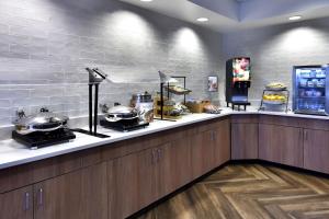 a kitchen with a counter with pots and pans on it at Fairfield Inn & Suites by Marriott Richmond Innsbrook in Richmond