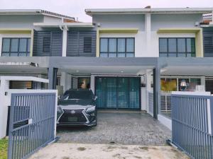 a car parked in front of a house at H+M Residence [5min]to Setia City Convention in Shah Alam