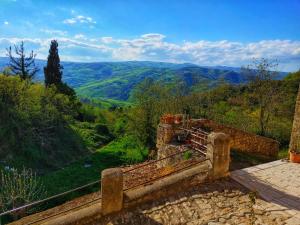 a stone bench with a view of a valley at Borgo Sciugolo in Baselice