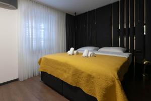 Posteľ alebo postele v izbe v ubytovaní City Premium Rooms Old town