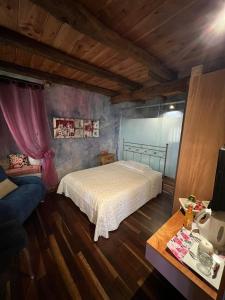 Postel nebo postele na pokoji v ubytování LA CASETTA NEI COLLI